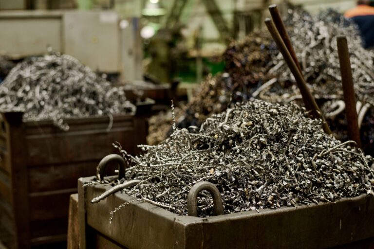 Bins of metal shavings collected for recycling inside a factory